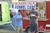 Local residents enjoy food truck food.